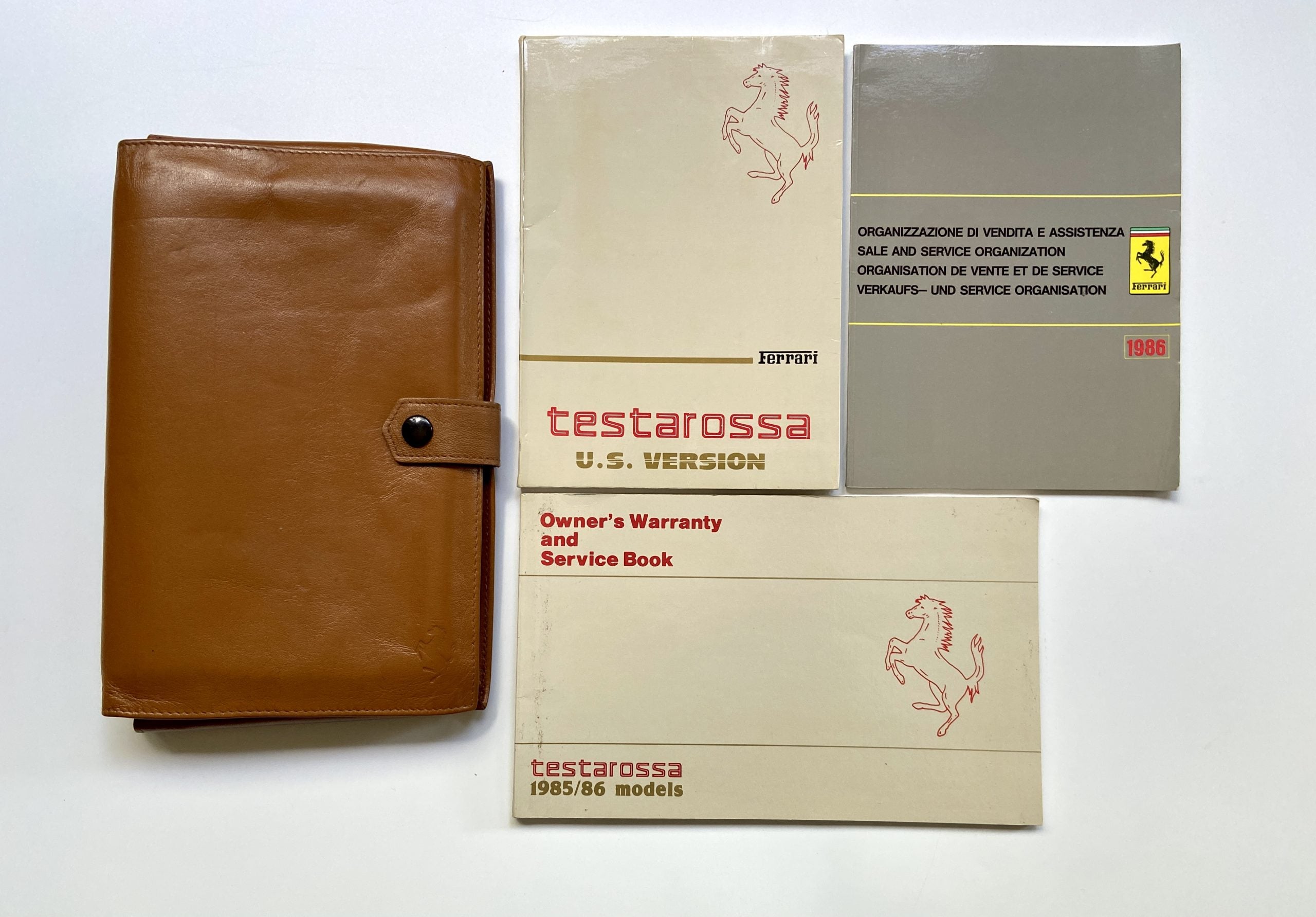 Ferrari Testarossa Leather Pouch U.S. Version 1985-86, Owner’s Manual #348/85, Dealer Directory #408/86, Warranty Card #346/85